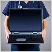 phycisian carrying laptop