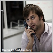 man on the phone with surprising face