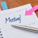 Daily planner with the entry Meeting